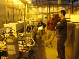 Students using the technology and tools in the mesocosm facility to work on a project.