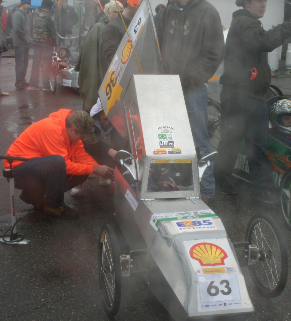 The team from Braham High School gets in some last-minute work before hitting the track.