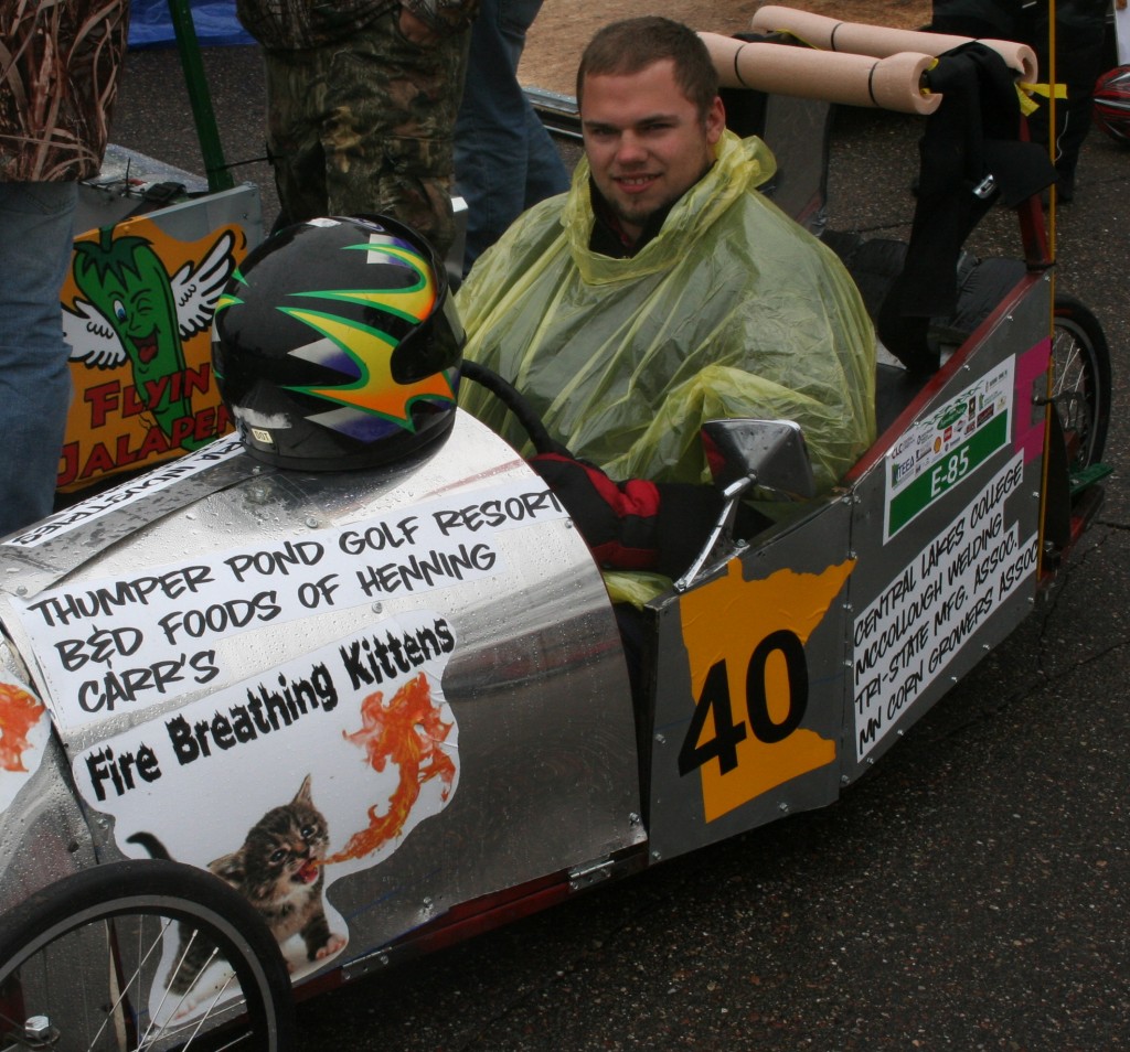 Aaron Larson from Henning trying to stay dry as he heads to the track.
