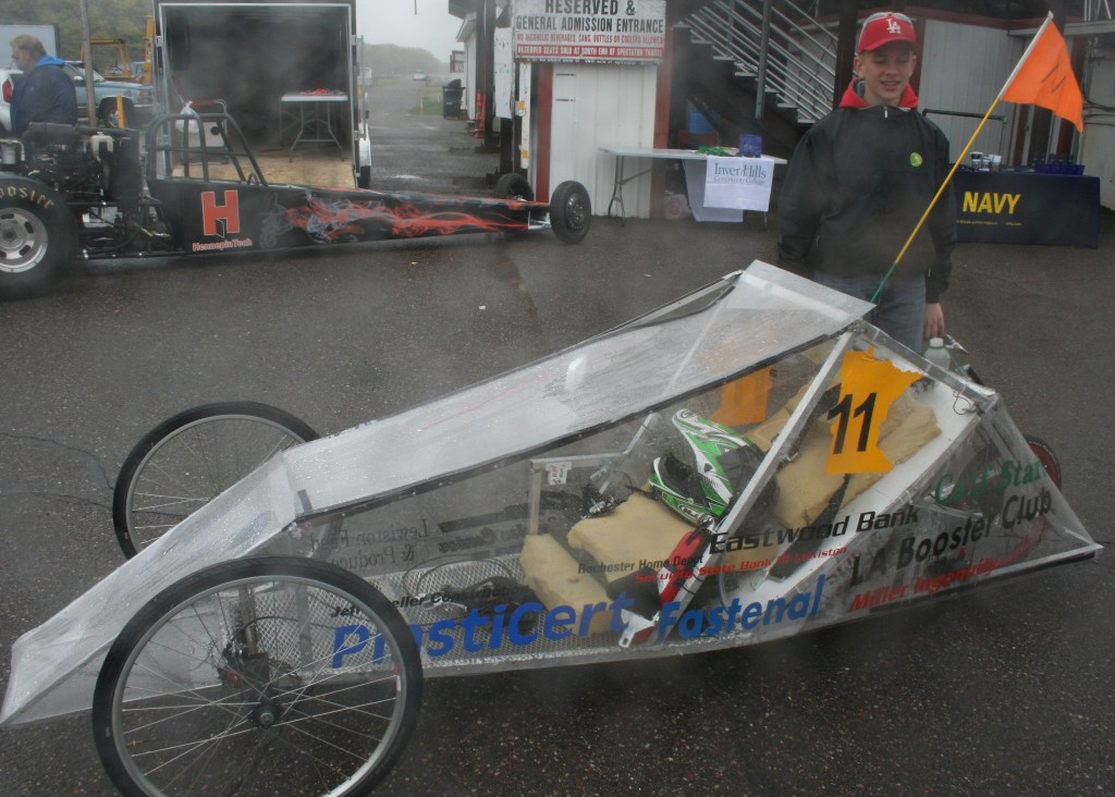 Christopher Schell waiting for his teammates from Lewiston-Altura before making their run.