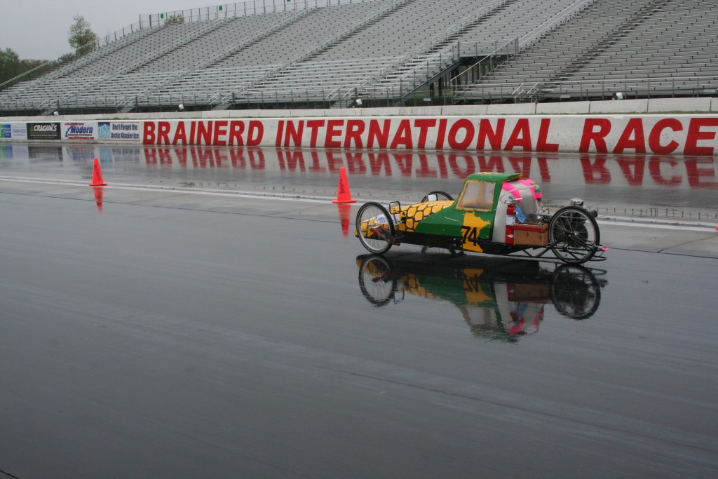 The Stewartville corn cob car heads down the track.