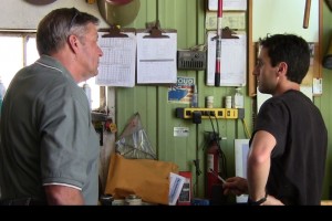 xxxxxxx, a farmer in xxxxx participating in the Root River Field-to-Stream project, talks about some of the date gathered at the edge of his fields with project coordinator Kevin Kuehner.