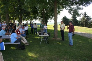 MCGA President Bruce Peterson, left, and Paulo Pagliari from the University of Minnesota talk soil health at Peterson's farm.