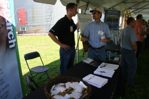 MCGA Executive Director Adam Birr, left, talks to a tour participant during the trade show.