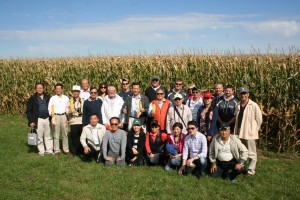 The Taiwan trade team delegation in front of a corn field on the Toquam family farm.