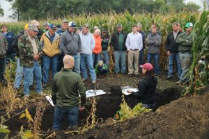Talking soil health on Bryan Biegler's farm near Lake Wilson.