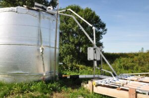 Watershed-scale bioreactor in a field with corn and soybeans, helping with nitrate removal